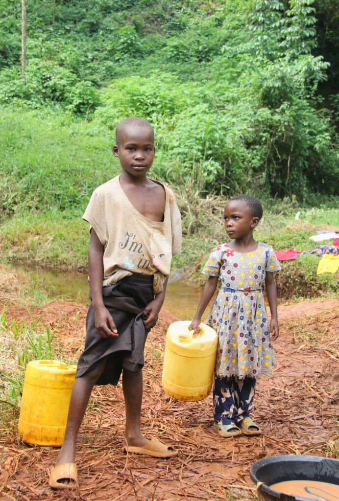 Children going to the well to draw water.