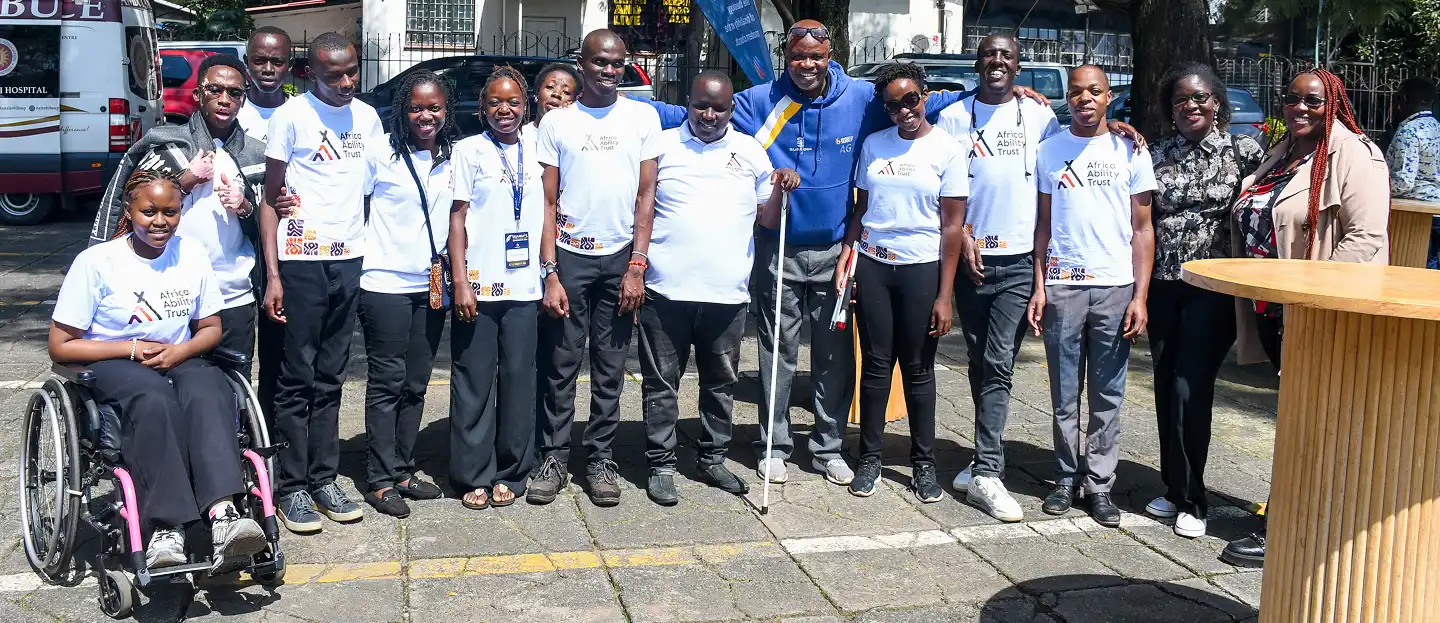 Our team, featuring members with different disabilities, posing for a photo at the conference.